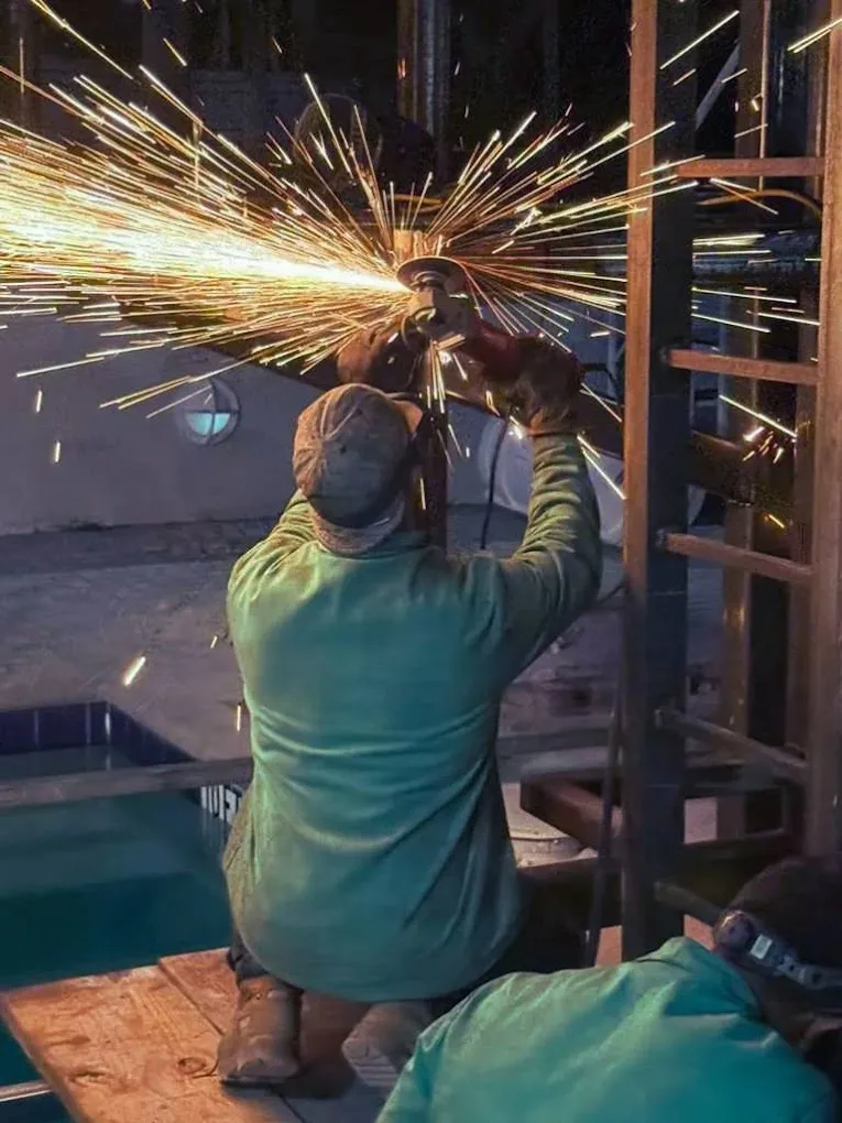 Welder working with heavy sparks on a Fort Lauderdale project